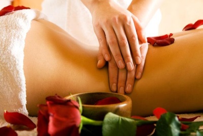 Lower back massage with tonka bean oil