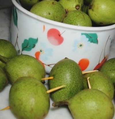 Collection of green walnuts